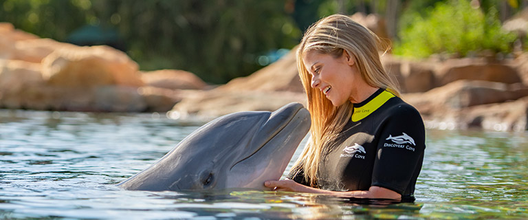 Swim with a dolphin at Discovery Cove