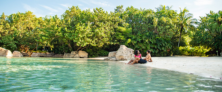 Relax around Serenity Bay at Discovery Cove